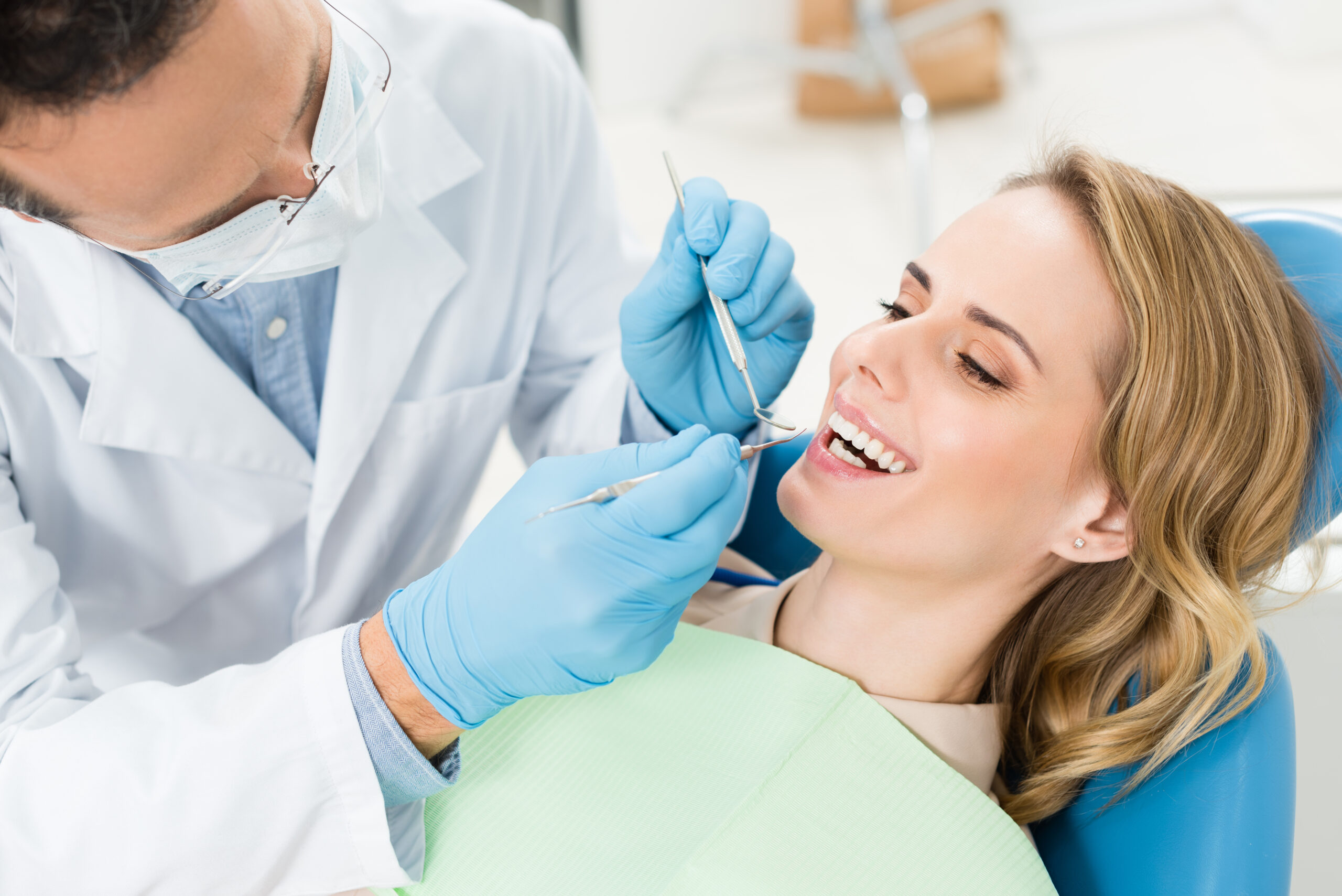 Doctor,Treats,Patient,Teeth,In,Modern,Dental,Clinic